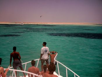 Scenic view of sea with boat in background
