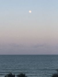 Scenic view of sea against sky at dusk