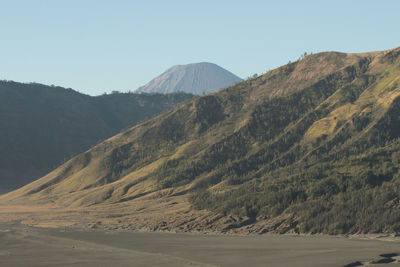 Scenic view of arid landscape against clear sky