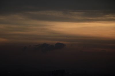 Scenic view of landscape against cloudy sky