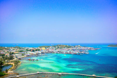 Aerial view of bay against blue sky