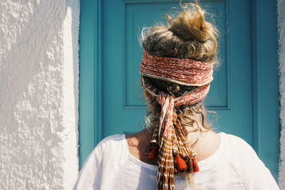 Close-up of woman against window