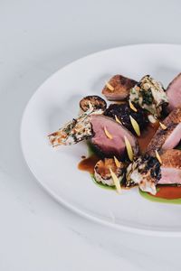 High angle view of meat in plate on table