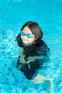 Portrait of woman swimming in pool