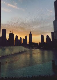 Scenic view of buildings against sky during sunset