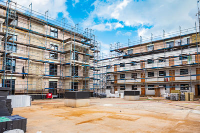 Buildings in city against sky