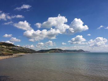 Scenic view of sea against cloudy sky