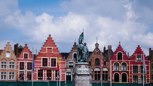 Panoramic view of buildings in city against sky