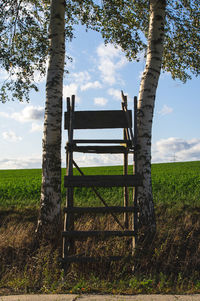 Built structure on field against sky