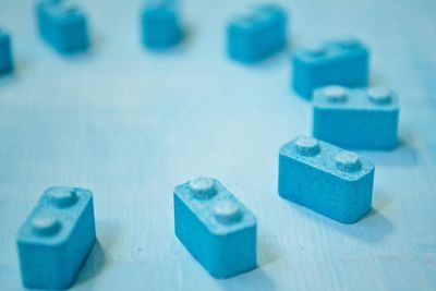 High angle view of blue block candies on table