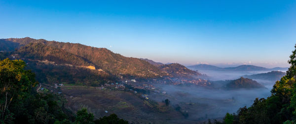 High angle view of mountains against blue sky