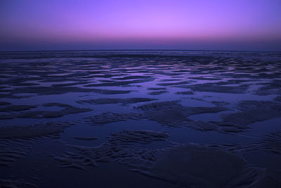 Scenic view of sea against sky at sunset