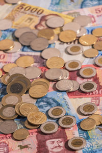 High angle view of coins on table