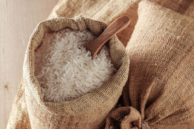 Sack with rice on table