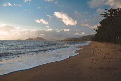 Scenic view of beach against sky during sunset