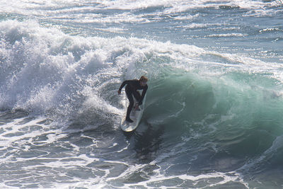 Man surfing in sea