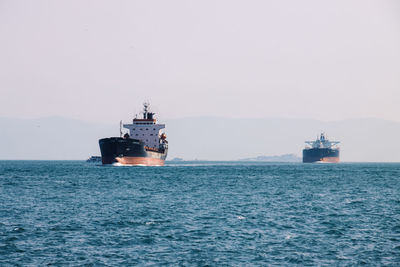 Ship in sea against clear sky