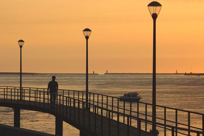 Silhouette of man overlooking sea