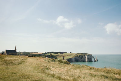 High angle view of cliff by sea at etretat