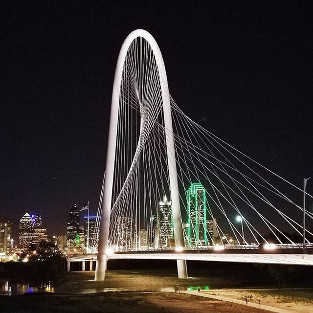 built structure, architecture, bridge - man made structure, night, connection, engineering, illuminated, clear sky, bridge, railing, suspension bridge, low angle view, city, copy space, building exterior, sky, transportation, street light, footbridge, travel destinations