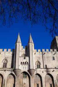 Low angle view of building against blue sky