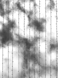 Full frame shot of fence against sky