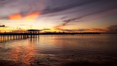 Scenic view of sea against orange sky