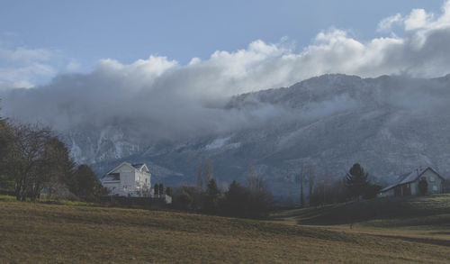 Scenic view of landscape and mountains against sky