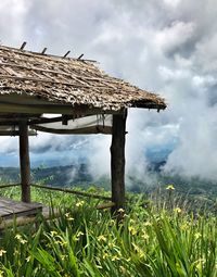 Built structure on field against sky