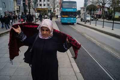 Woman walking on city street