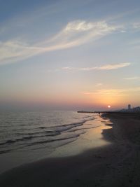 Scenic view of beach against sky during sunset