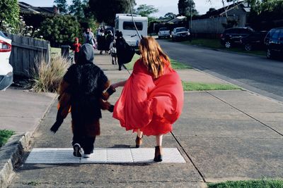 Rear view of woman walking on street