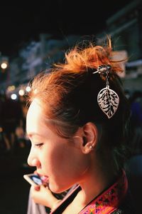 Side view of young woman with barrette