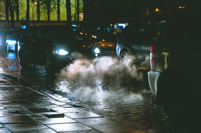 Cars on wet street during rainy season