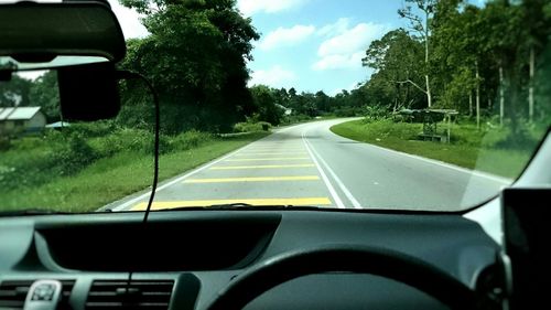 Road seen through car windshield