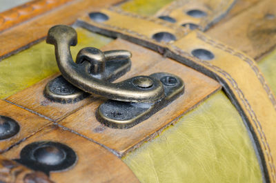 Close-up of metallic handle on suitcase