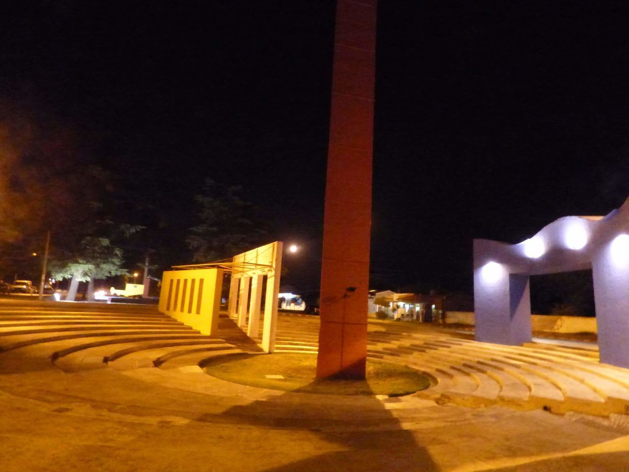 ILLUMINATED BUILDING AGAINST SKY AT NIGHT