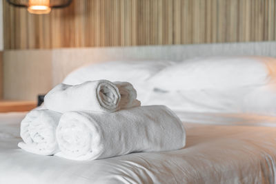 Towels on bed in hotel