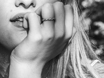 Close-up of woman with tattoo on hand