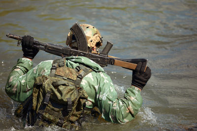 High angle view of army soldiers in lake
