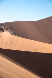 Scenic view of desert against clear sky