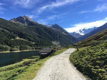 Road amidst mountains against sky
