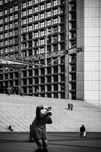 Woman standing in front of building