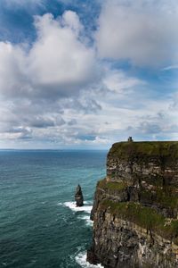 Scenic view of sea against cloudy sky