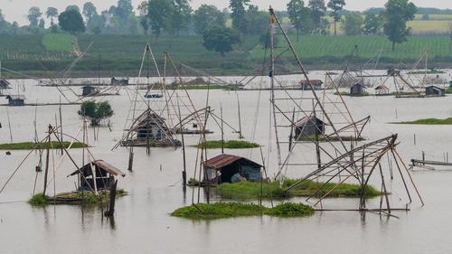 High angle view of fishing net on lake against building