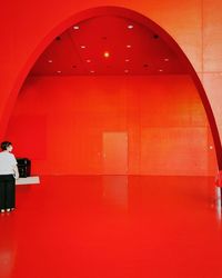 Low angle view of illuminated red wall