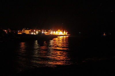 Reflection of illuminated buildings in water
