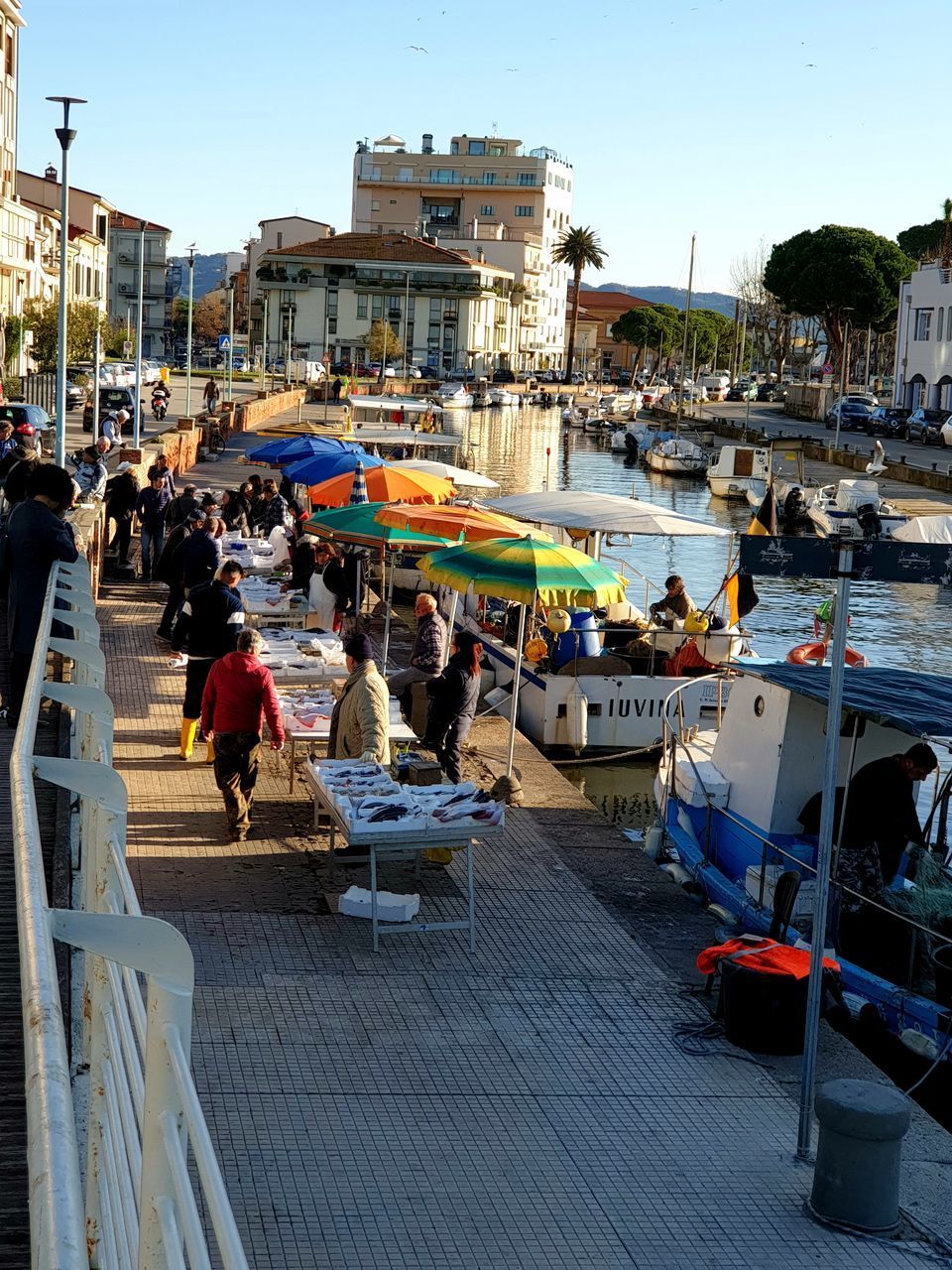 PEOPLE ON BOATS IN CITY