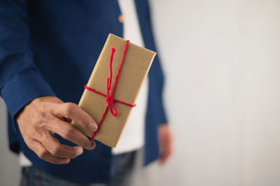 Close-up of hand holding paper