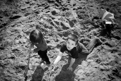 Little girl playing with arms raised